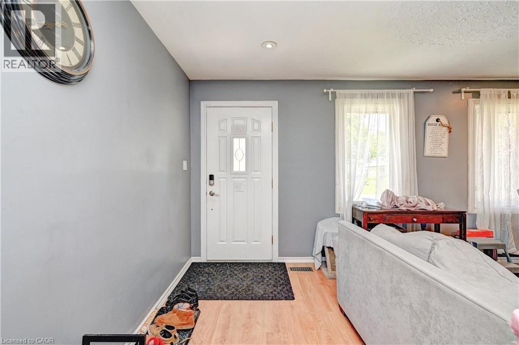 White paneled entry door with decorative glass inserts - 525 Fallingbrook Drive, Waterloo, ON
