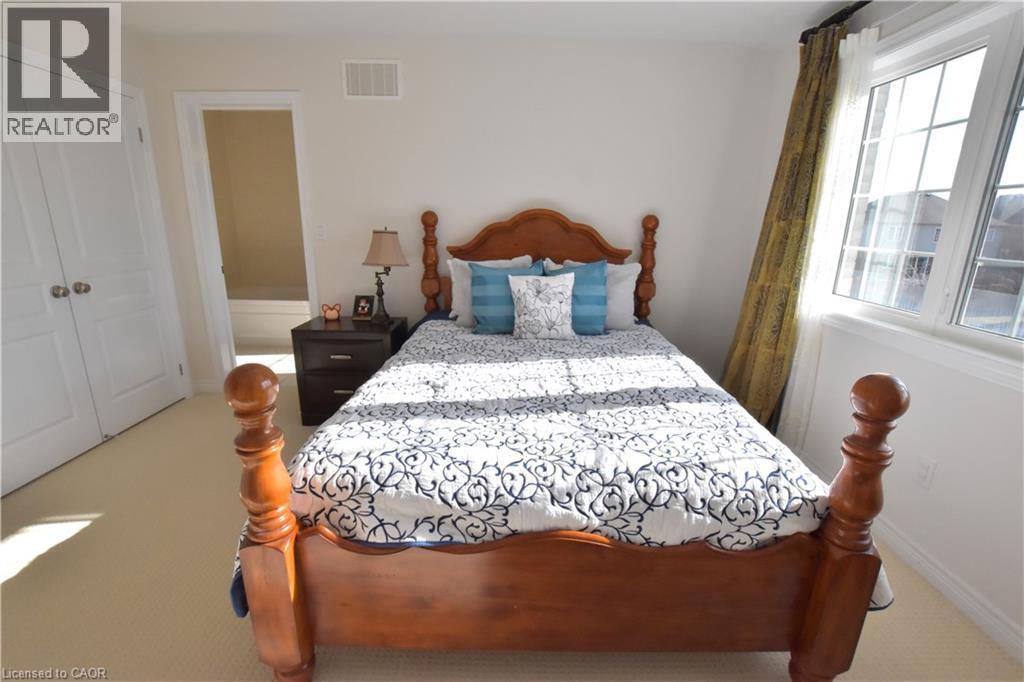 Carpeted bedroom featuring a closet - 512 Terrington Crescent, Kitchener, ON