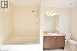 Full bath featuring vanity and tub / shower combination -