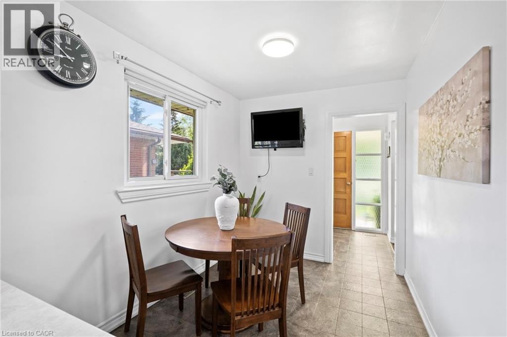 Bright interior space featuring a window with exterior views, white walls, and neutral-toned floor tiling - 1083 Melton Drive, Mississauga, ON