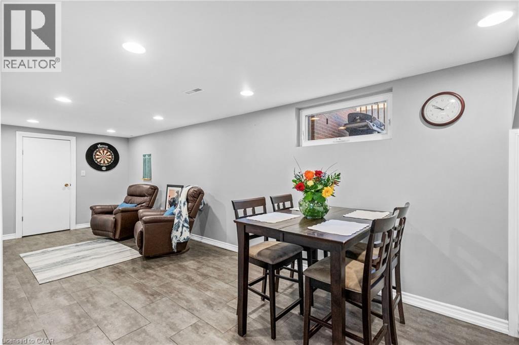 Finished lower level featuring recessed lighting, a window, and wood-finish tile flooring - 1083 Melton Drive, Mississauga, ON