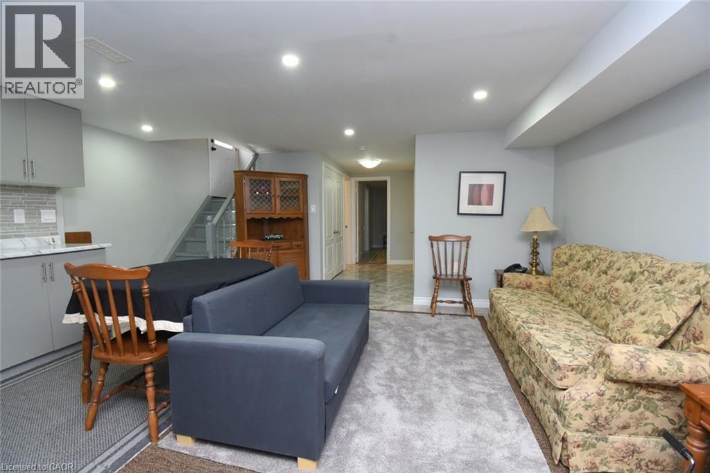 Lower level living area featuring light gray walls, recessed lighting, and a neutral-toned carpet - 185 Rosslyn Avenue N, Hamilton, ON - Indoor Photo Showing Living Room