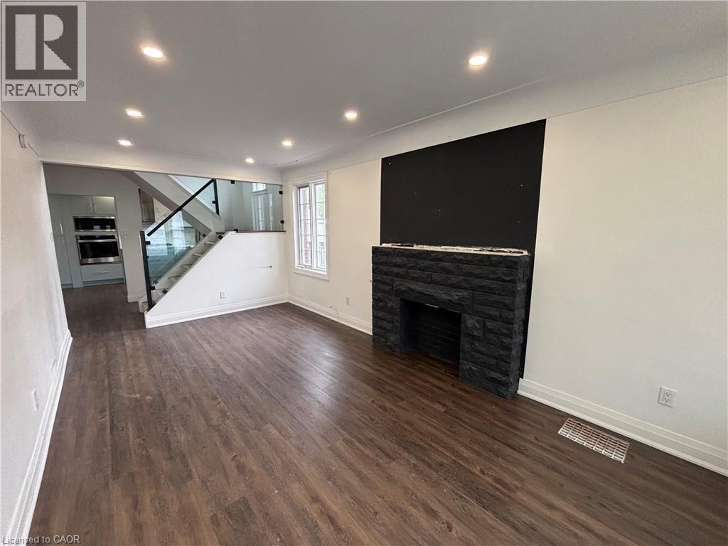 122 Queensdale Avenue E, Hamilton, ON - Indoor With Fireplace