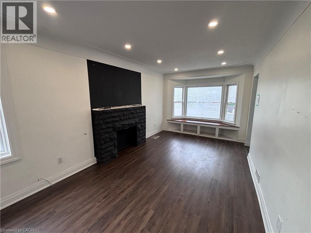 122 Queensdale Avenue E, Hamilton, ON - Indoor With Fireplace