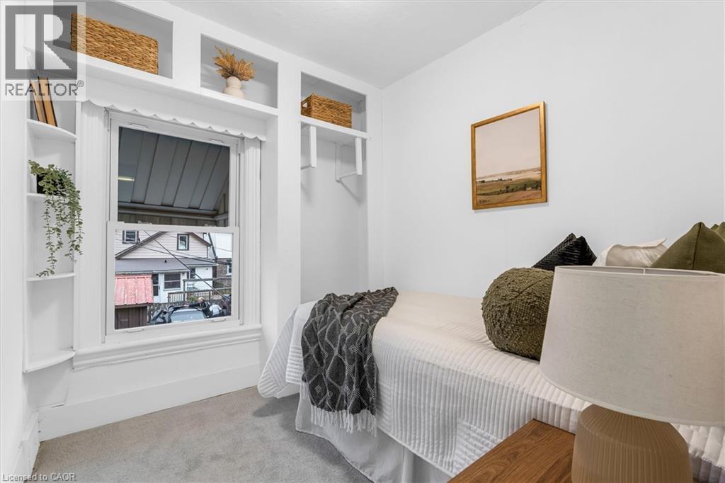 White-painted room featuring carpet flooring - 11 Ford Street, Hamilton, ON