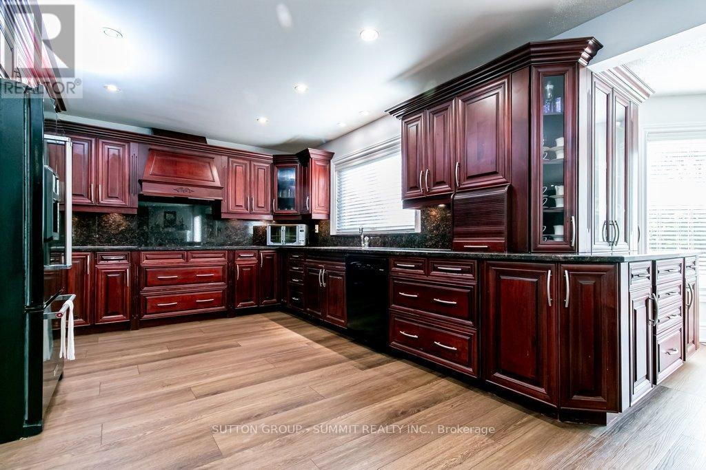 Cherry wood cabinets - 3739 St. Laurent Court, Mississauga, ON