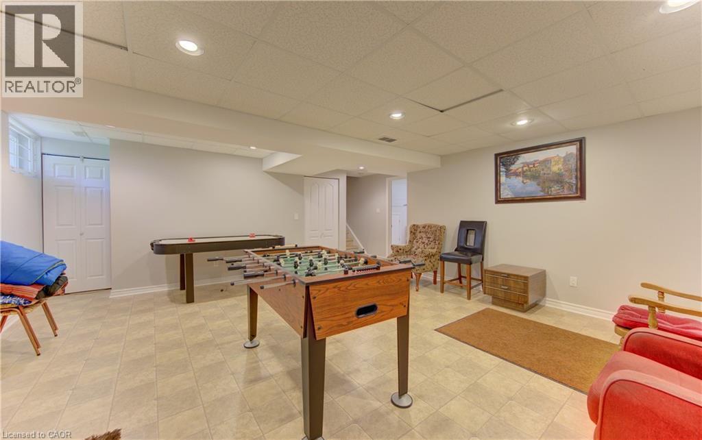 Spacious finished basement featuring recessed lighting, light-toned floor tiles, and painted walls - 599 Coldstream Drive, Waterloo, ON