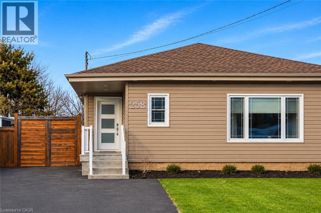 Single-story residence featuring light brown siding and a complementary brown shingle roof - 258 Sanatorium Road, Hamilton, ON