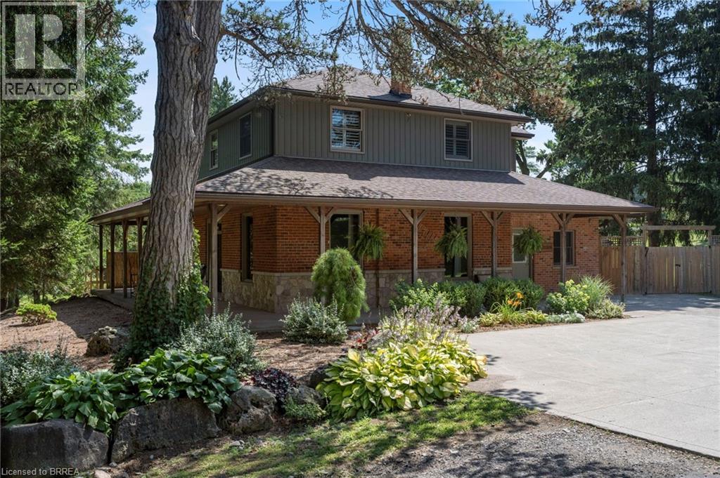 Brick and board and batten exterior with stone accents - 182 Governors Road E, Paris, ON