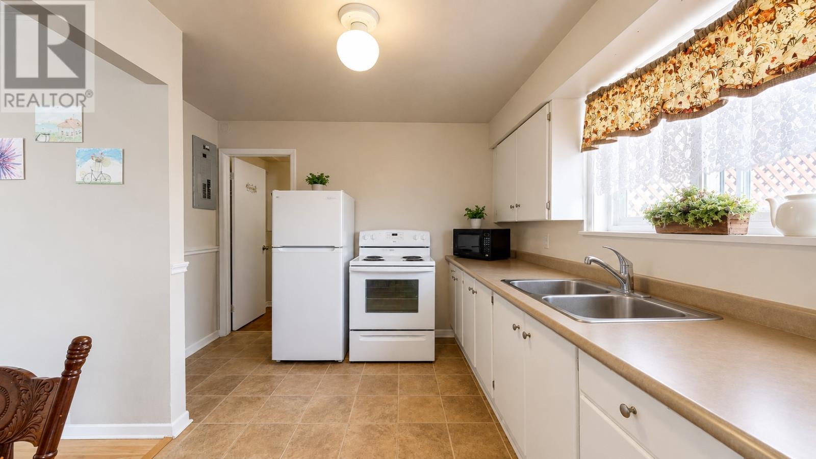 Basement apartment kitchen AI tidy - 52 Canada Drive, St. John'S, NL