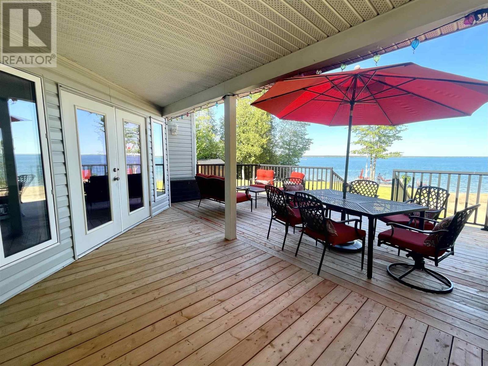 2778 Canoe Point Rd, Hilton Beach, ON - Outdoor With Body Of Water With Deck Patio Veranda With Exterior
