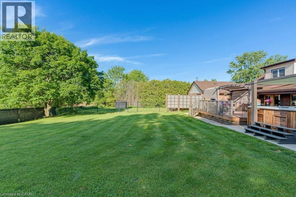 Expansive green lawn with mature perimeter trees - 3786 Old Beverly Road, North Dumfries, ON