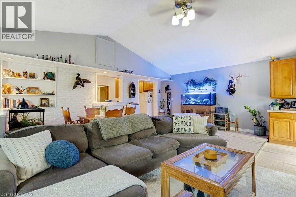 Apartment Vaulted ceiling living space with light wood-finish flooring, featuring recessed lighting and a ceiling fan - 3786 Old Beverly Road, North Dumfries, ON
