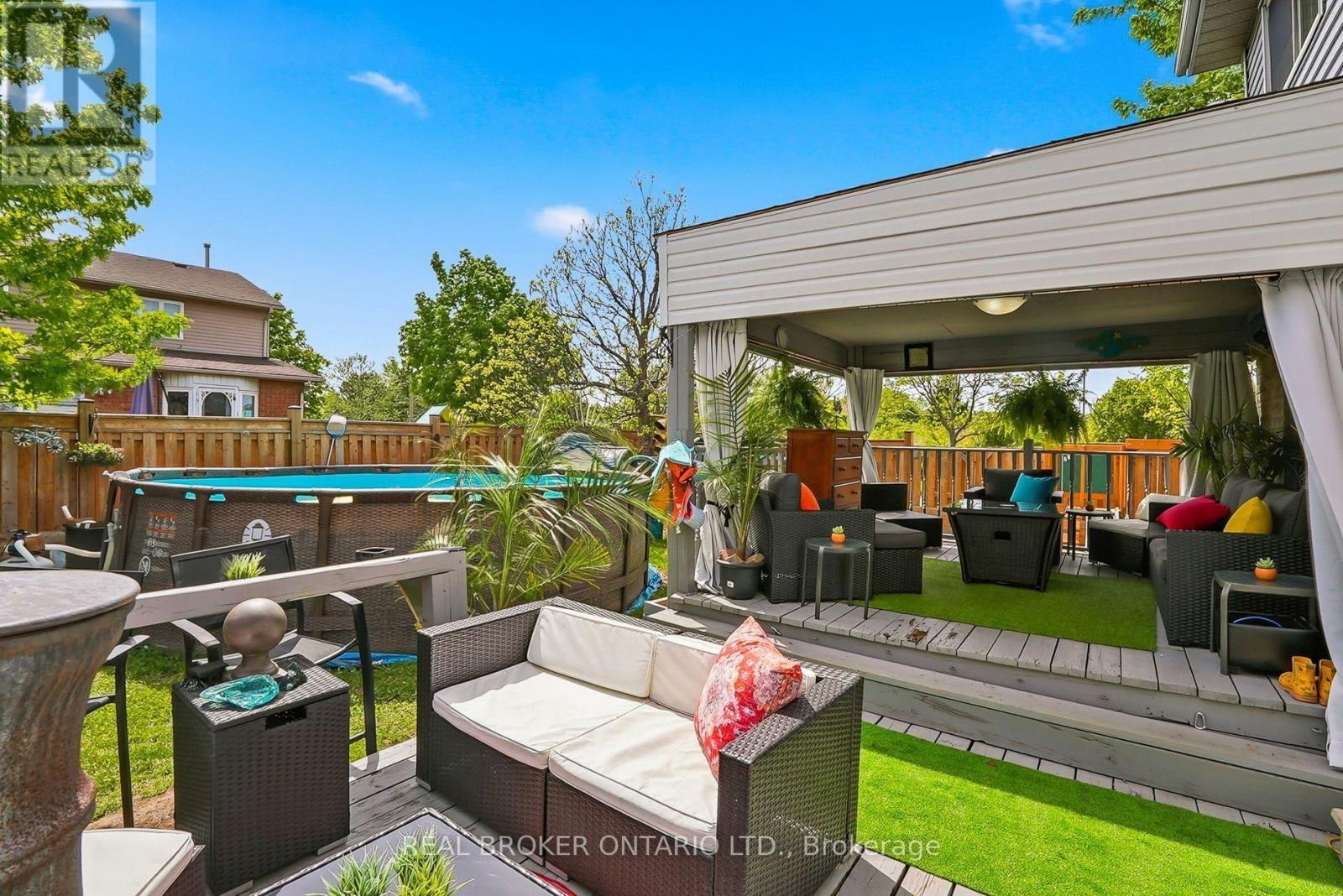 Large tiered deck overlooking pool & child play - 3260 Woodcroft Crescent, Burlington, ON