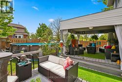 Large tiered deck overlooking pool & child play -