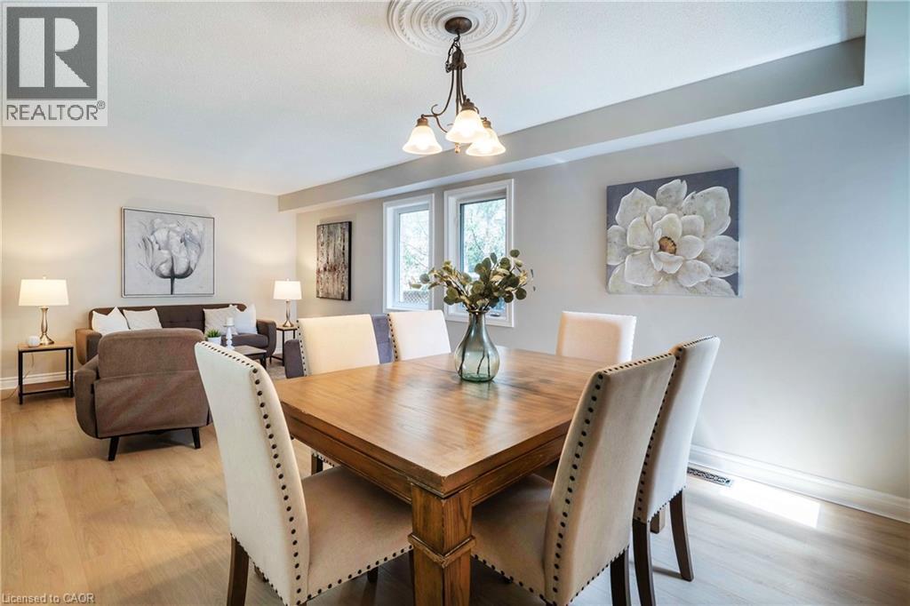 Open-concept living space featuring wood-finish flooring, recessed lighting, and a decorative ceiling medallion - 2425 Nichols Drive, Oakville, ON - Indoor Photo Showing Dining Room