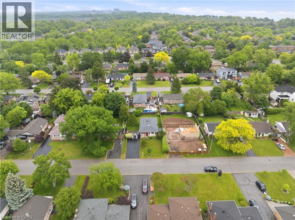 Aerial perspective showcasing an established neighborhood with a verdant tree canopy - 189 Foxbar Road, Burlington, ON