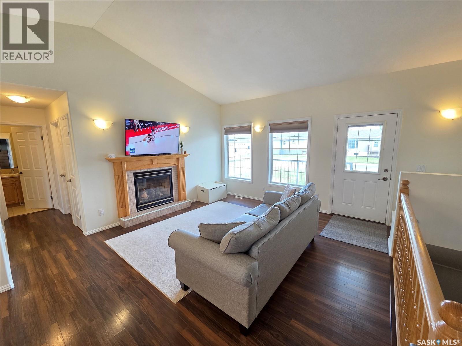 12 Arcola Place, Carlyle, SK - Indoor Photo Showing Living Room With Fireplace