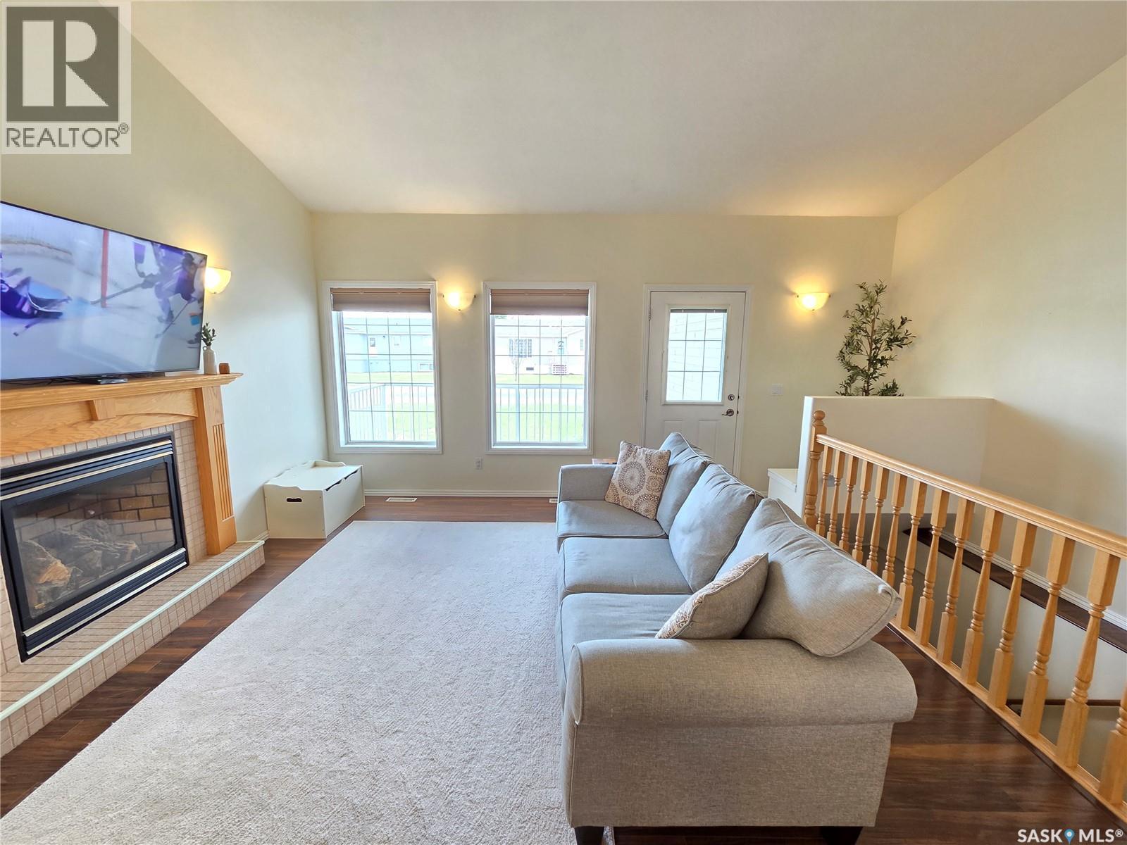 12 Arcola Place, Carlyle, SK - Indoor Photo Showing Living Room With Fireplace