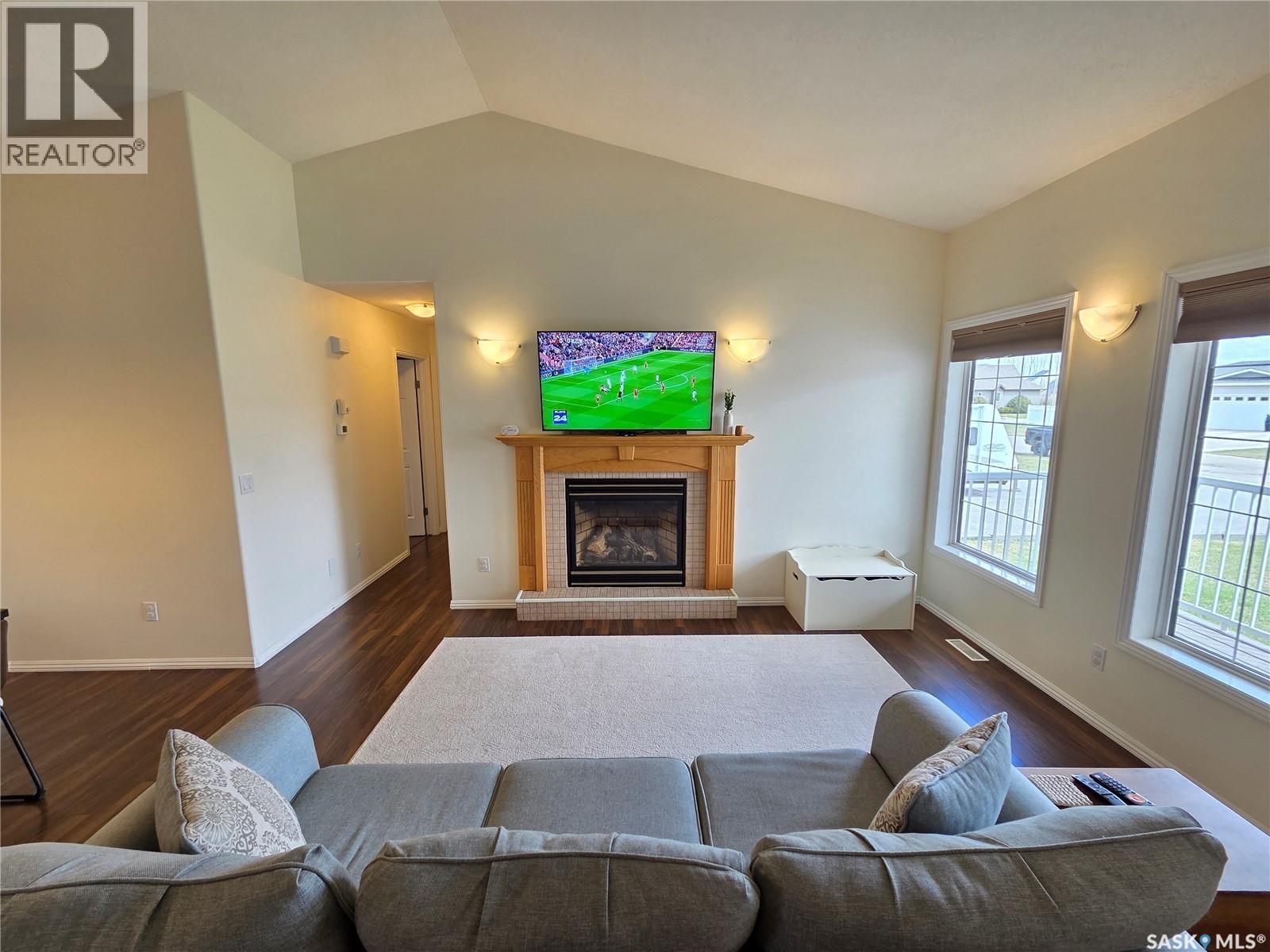 12 Arcola Place, Carlyle, SK - Indoor Photo Showing Living Room With Fireplace