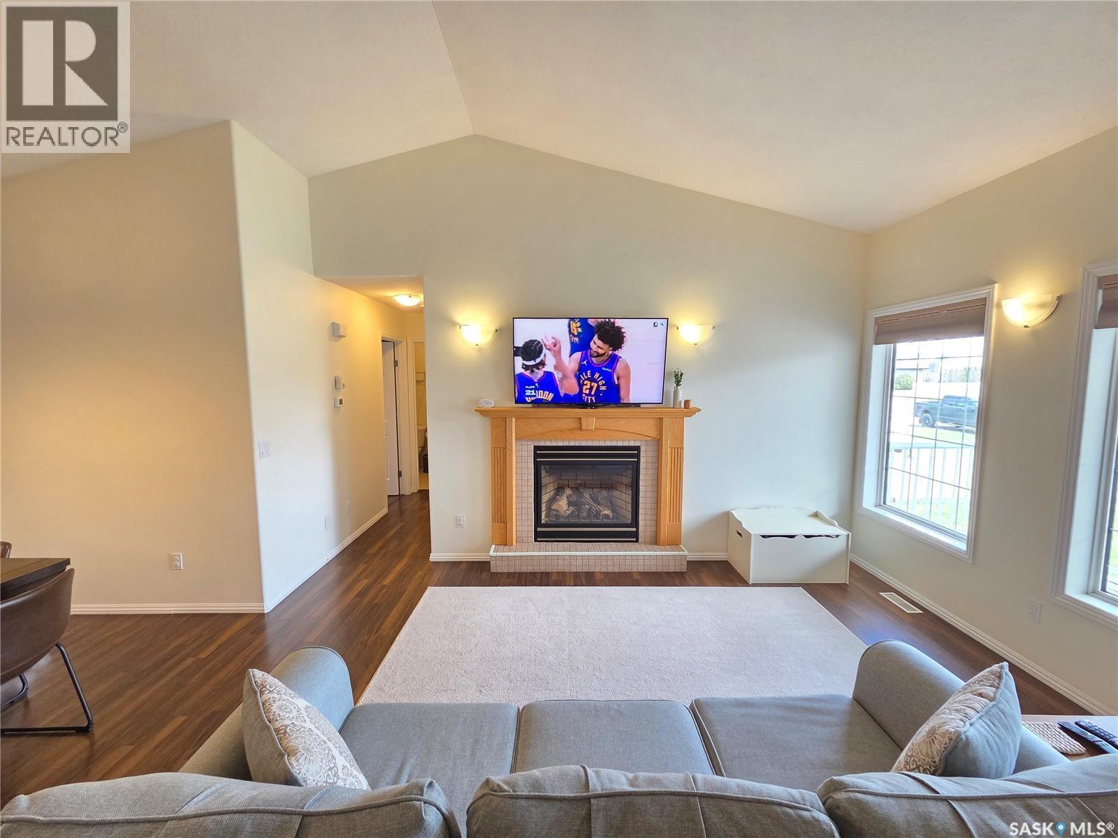 12 Arcola Place, Carlyle, SK - Indoor Photo Showing Living Room With Fireplace