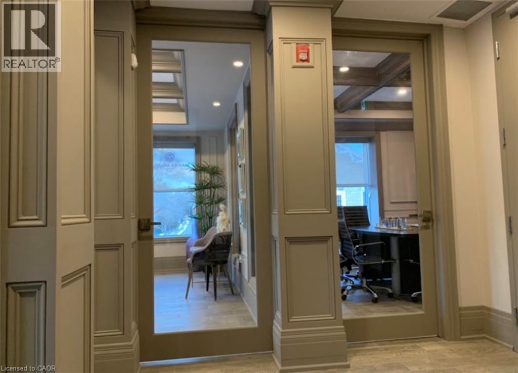 Glass-paneled doors with paneled trim and crown molding - 385 E Wilson Street E Unit# 201, Ancaster, ON