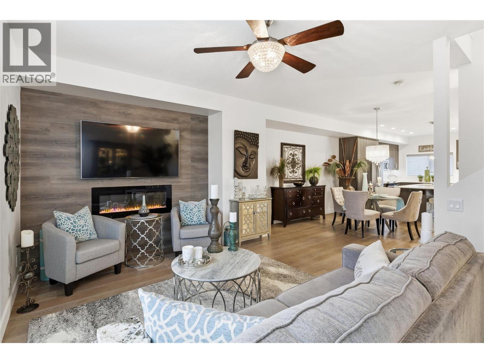 Welcome to #10-300 Drysdale Blvd - 300 Drysdale Boulevard Unit# 10, Kelowna, BC - Indoor Photo Showing Living Room With Fireplace