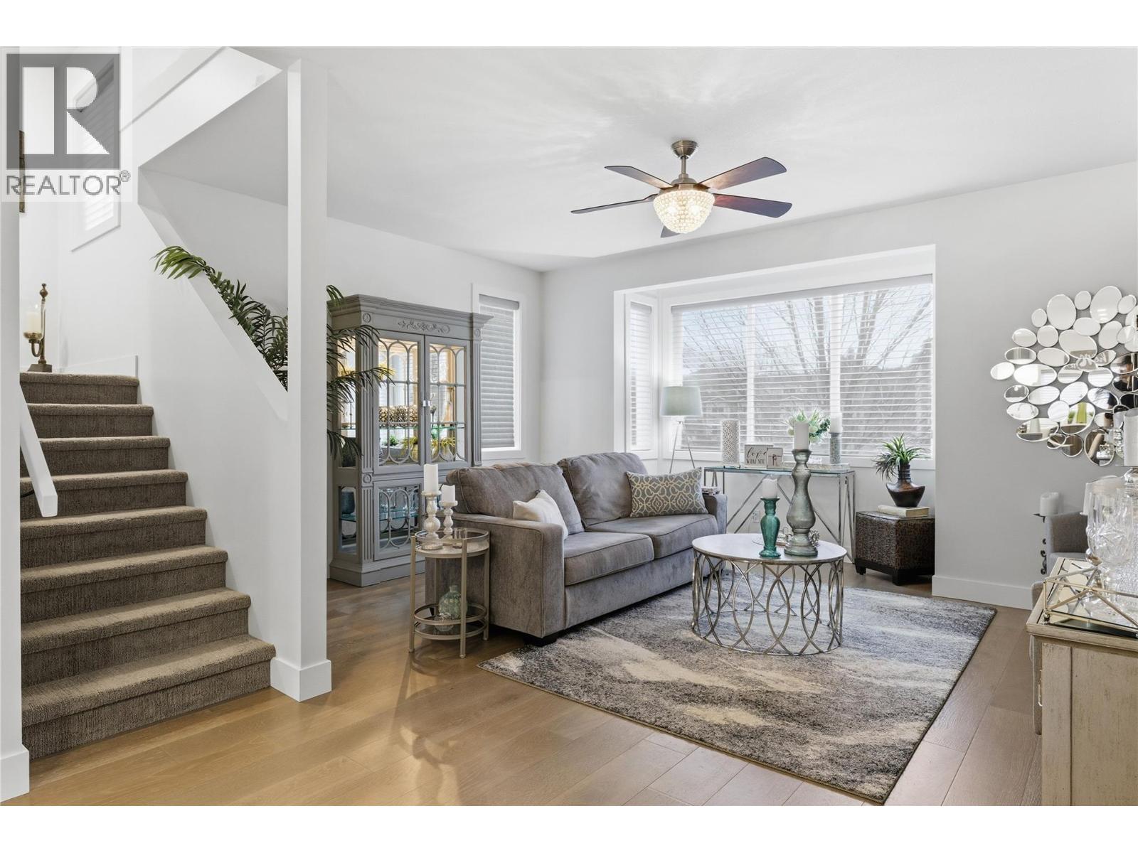 wide-plank engineered hardwood floors - 300 Drysdale Boulevard Unit# 10, Kelowna, BC - Indoor Photo Showing Living Room