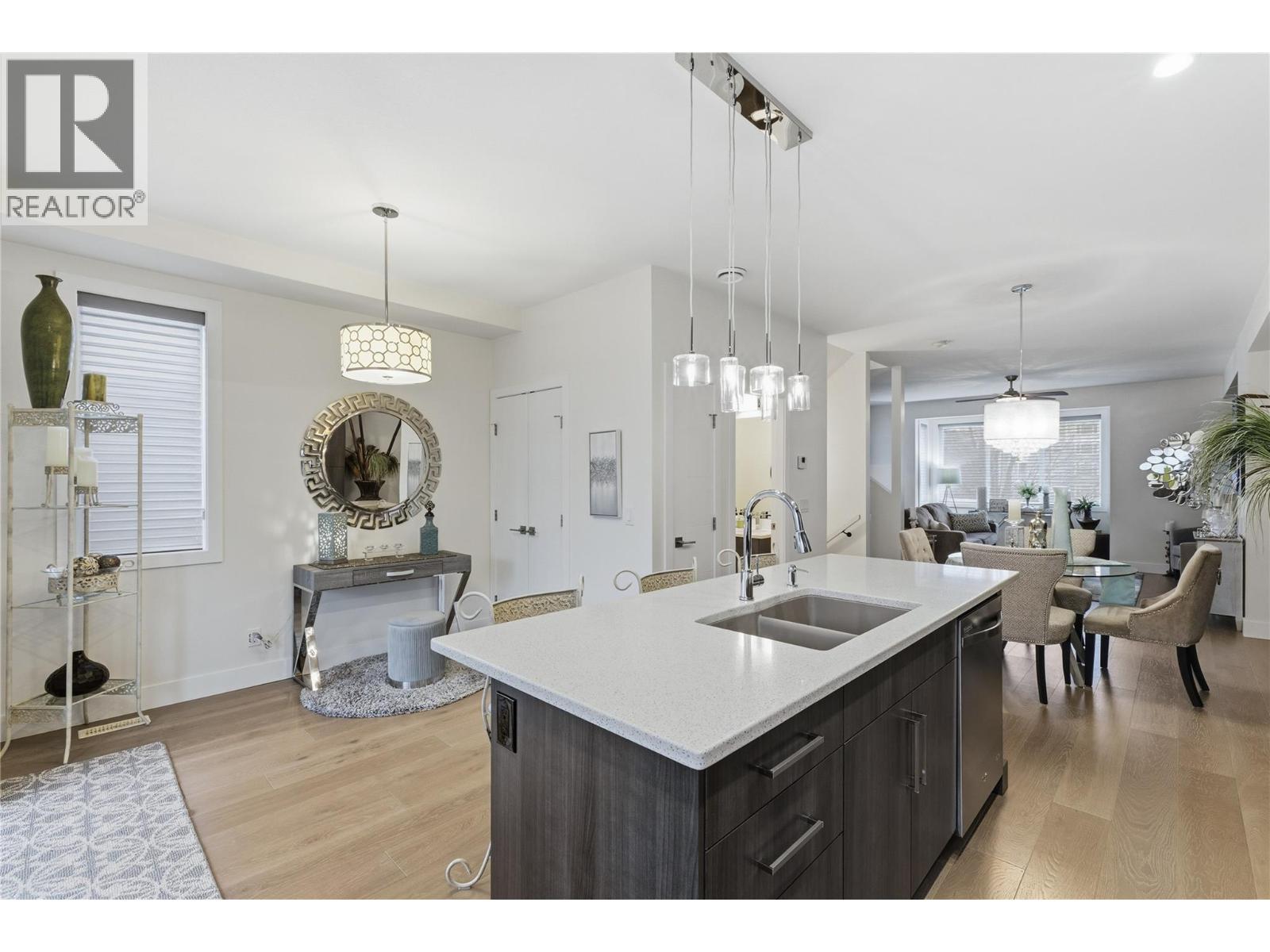 with Abundance of cabinetry - 300 Drysdale Boulevard Unit# 10, Kelowna, BC - Indoor Photo Showing Kitchen With Double Sink