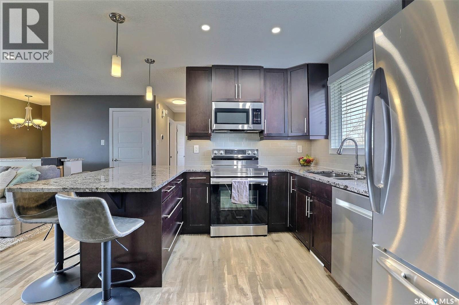 110 Fulton Drive, Regina, SK - Indoor Photo Showing Kitchen With Stainless Steel Kitchen With Double Sink With Upgraded Kitchen