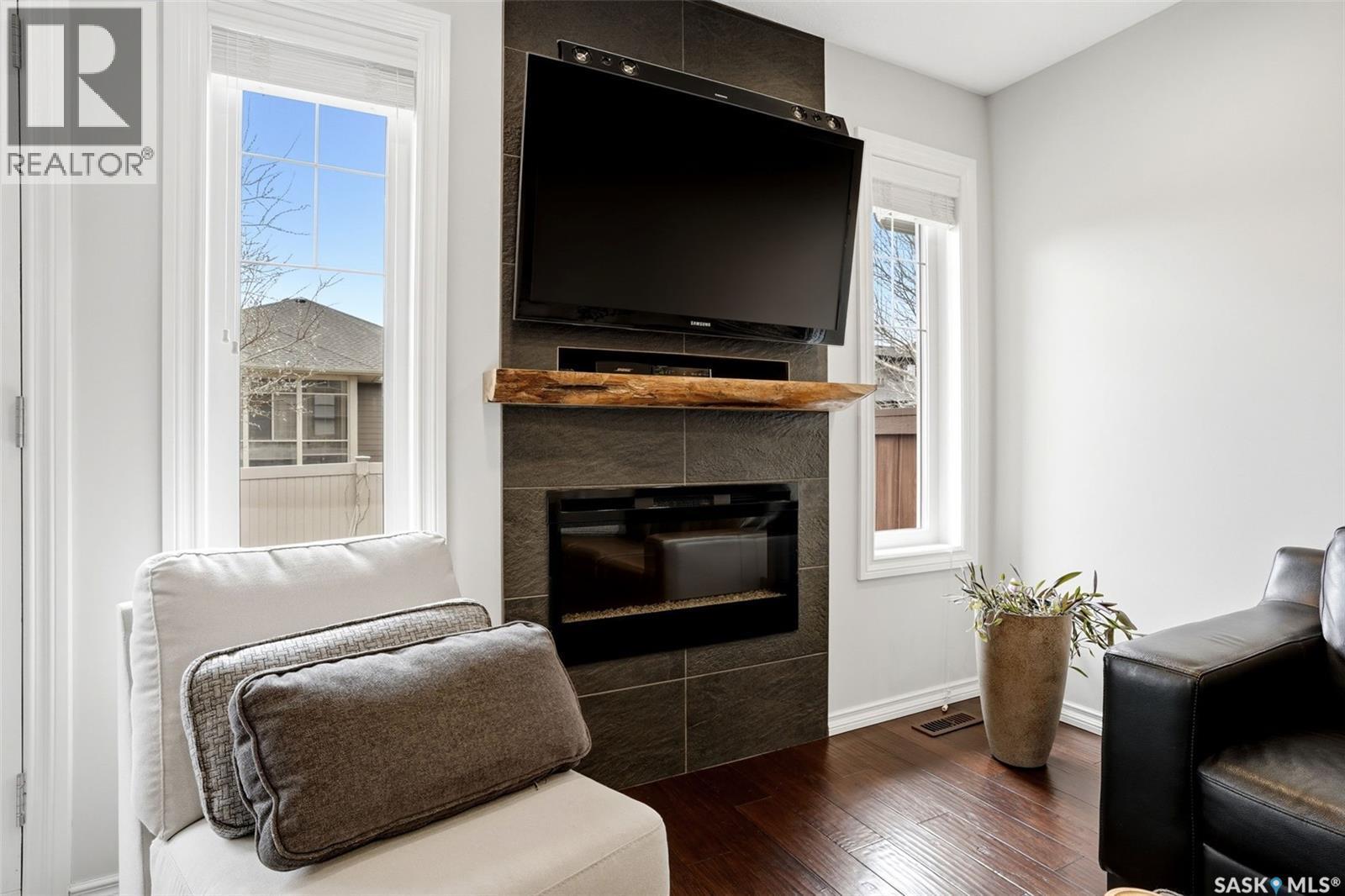 157 4100 Sandhill Crescent, Regina, SK - Indoor Photo Showing Living Room With Fireplace