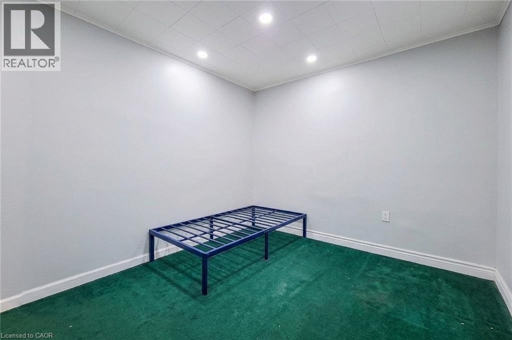 Room featuring light grey walls, green carpeting, recessed lighting, and white baseboards - 463 Wellington Street N, Hamilton, ON - Indoor Photo Showing Other Room