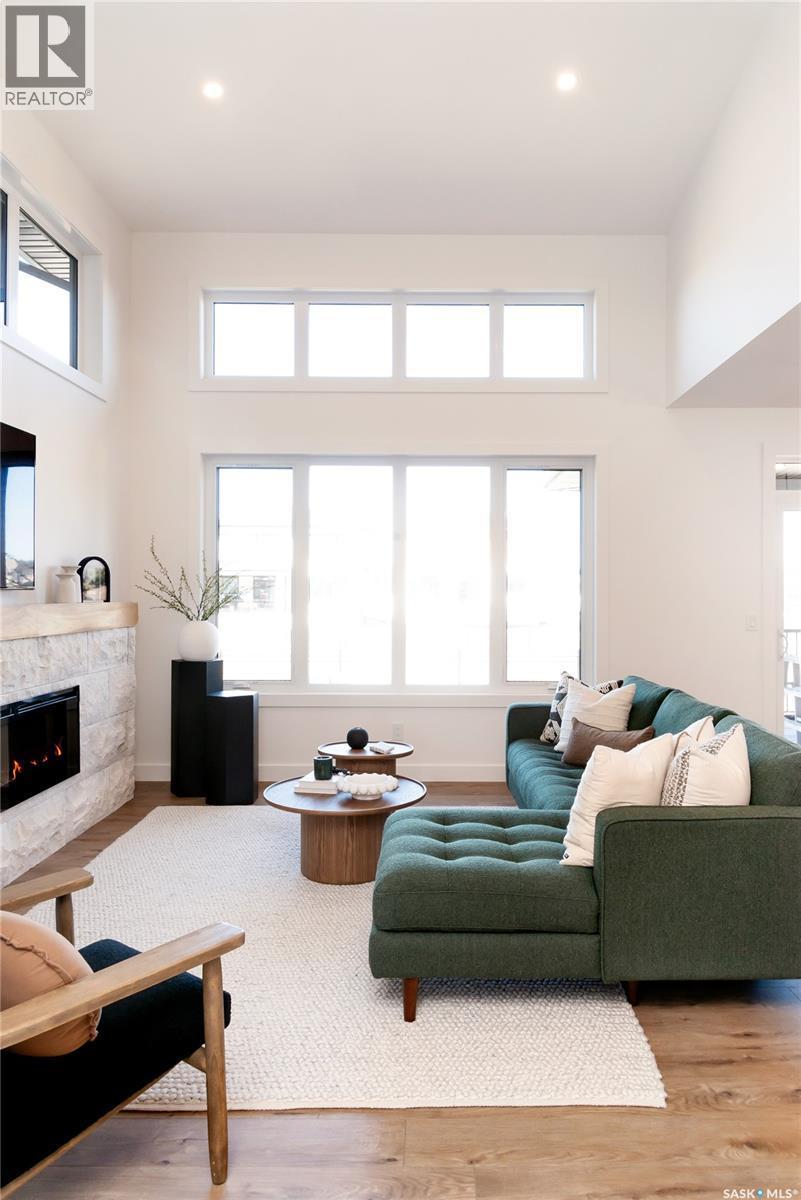 114 Cockcroft Manor, Saskatoon, SK - Indoor Photo Showing Living Room With Fireplace