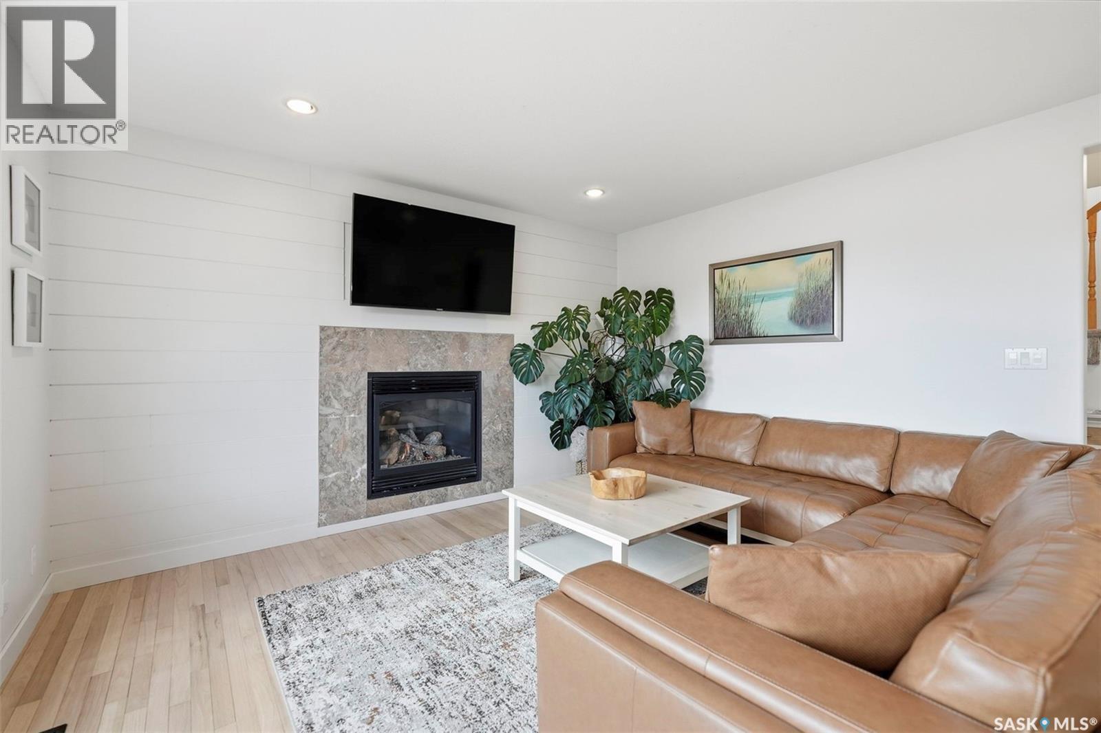402 Crystal Bay, Warman, SK - Indoor Photo Showing Living Room With Fireplace
