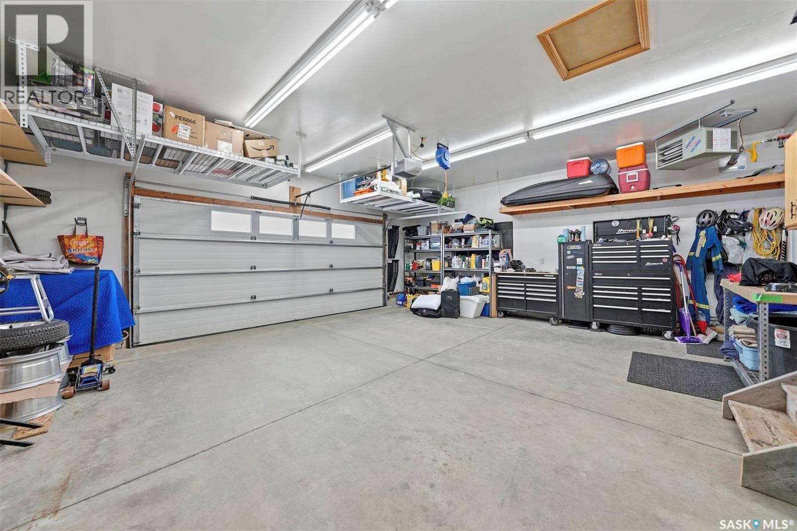 402 Crystal Bay, Warman, SK - Indoor Photo Showing Garage