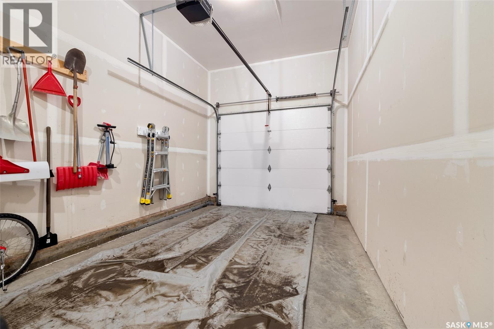 145 Plains Circle, Pilot Butte, SK - Indoor Photo Showing Garage