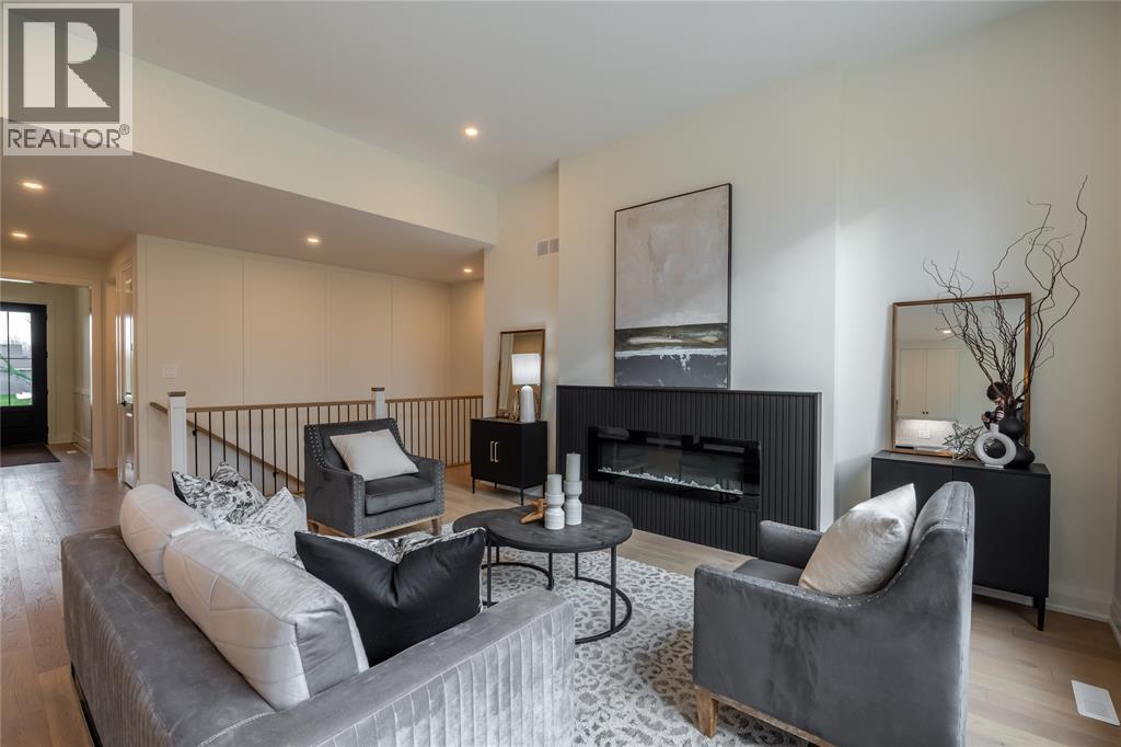 103 Sutherland Drive, St Clair, ON - Indoor Photo Showing Living Room With Fireplace