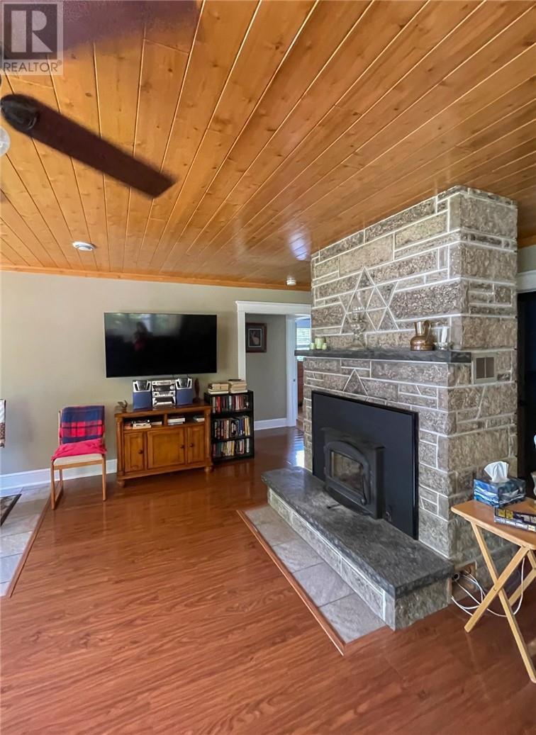 29 Sidney Lane, Mindemoya, ON - Indoor Photo Showing Living Room With Fireplace