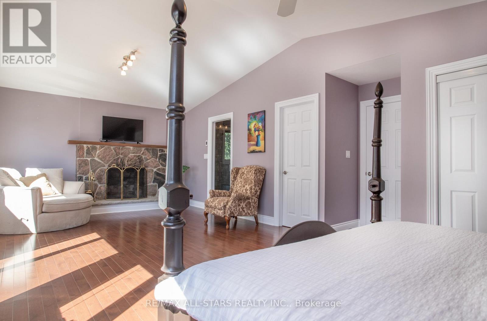 253 Stephenson Point Road, Scugog, ON - Indoor Photo Showing Bedroom With Fireplace