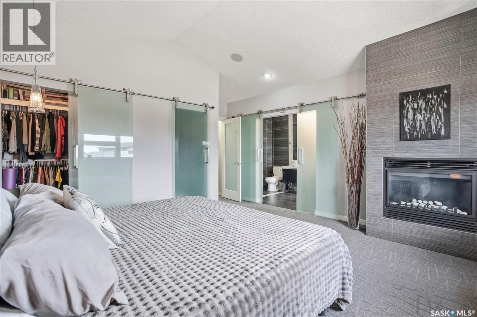 710 Sauer Crescent, Saskatoon, SK - Indoor Photo Showing Bedroom With Fireplace