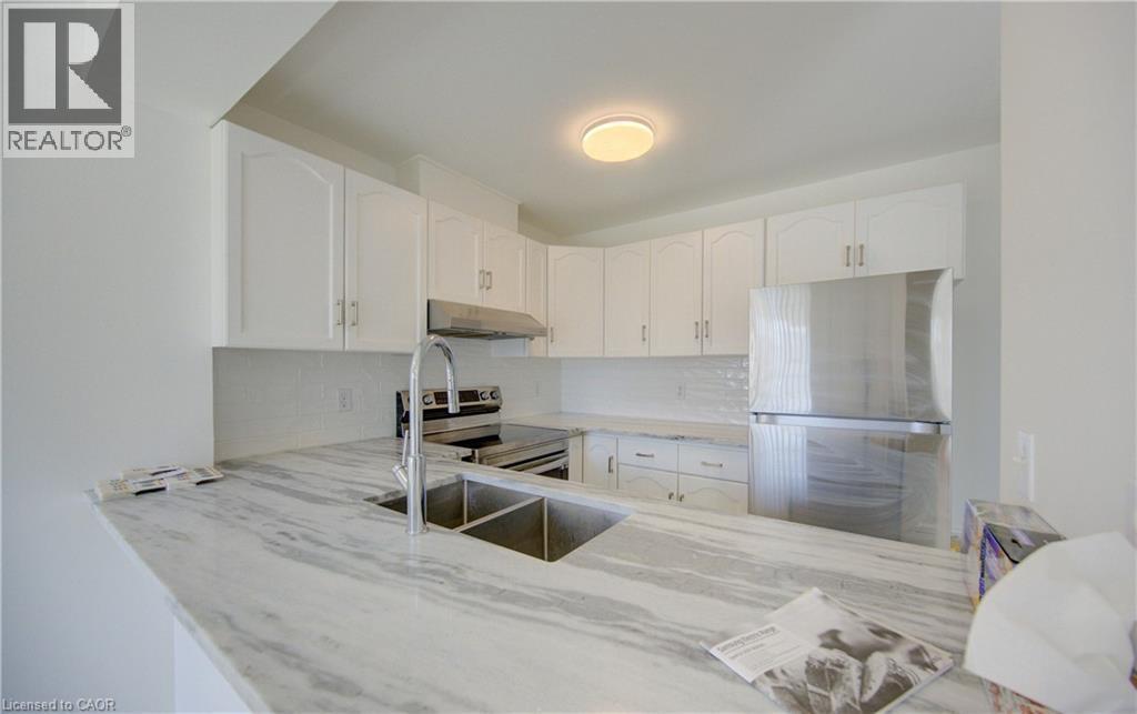 142 York Road Unit# 9, Guelph, ON - Indoor Photo Showing Kitchen With Double Sink