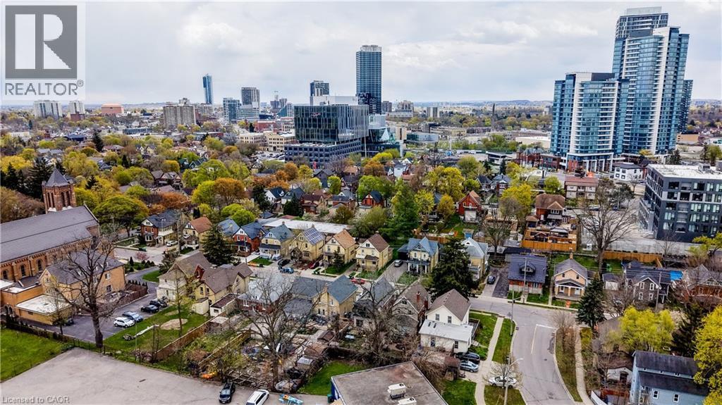 Aerial perspective showcasing a residential neighborhood with varying architectural styles, mature trees, and a visible street grid - 46 Shanley Street, Kitchener, ON - Outdoor With View