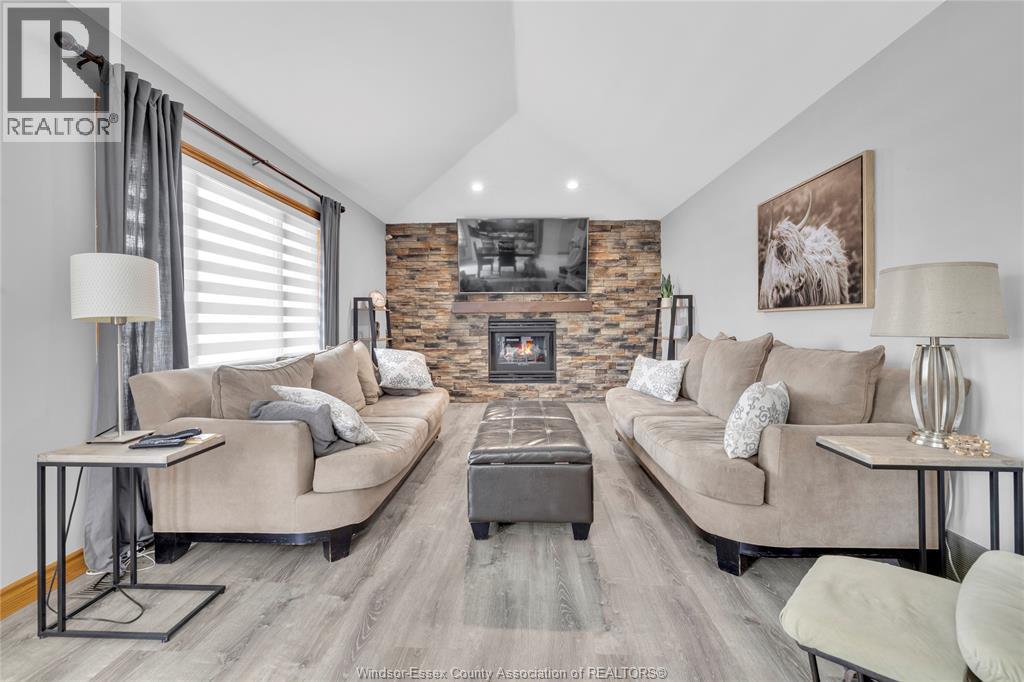 2048 Eugeni, Tecumseh, ON - Indoor Photo Showing Living Room With Fireplace