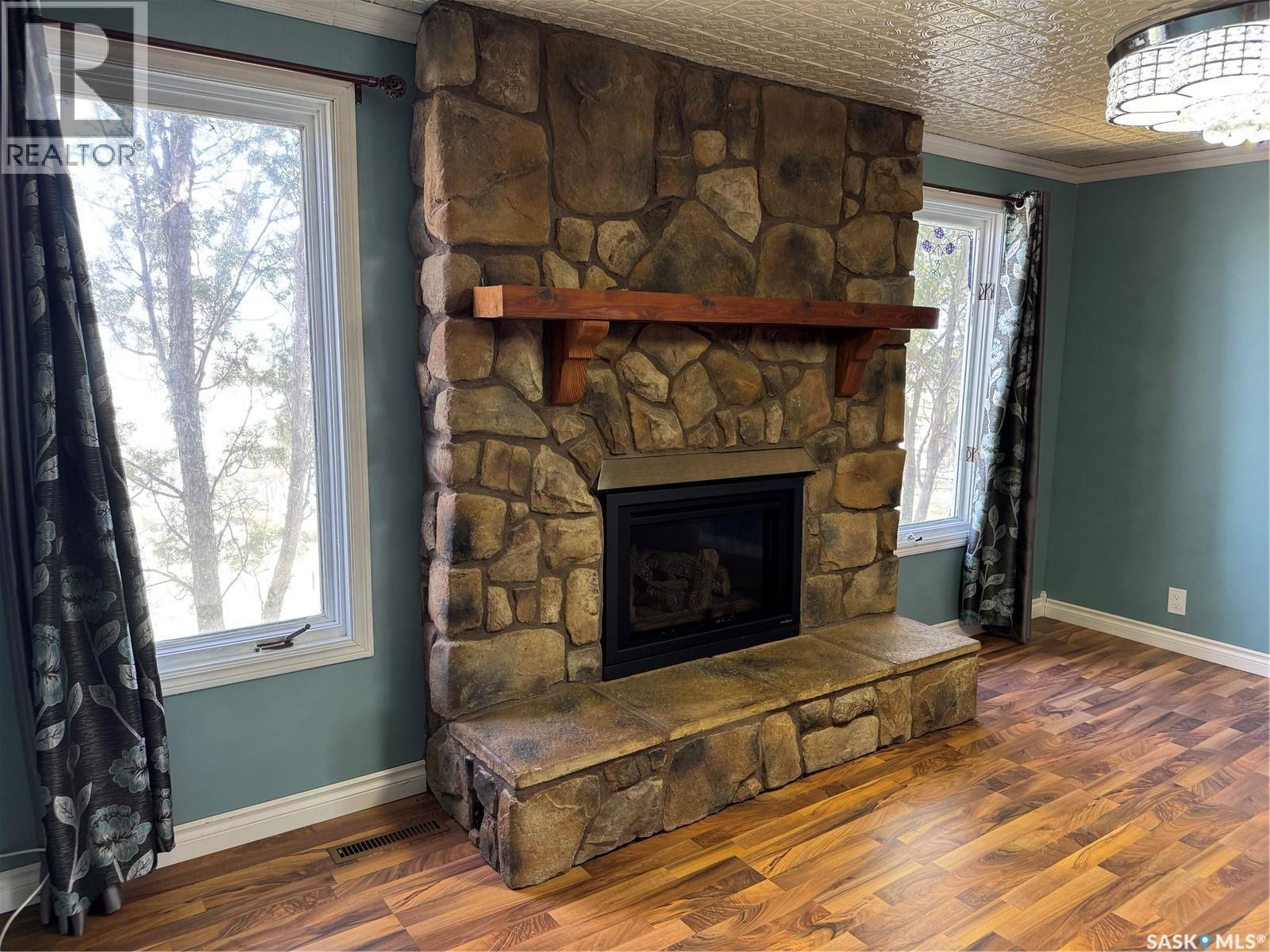 Prairie Preserves Acreage, Macoun, SK - Indoor Photo Showing Living Room With Fireplace