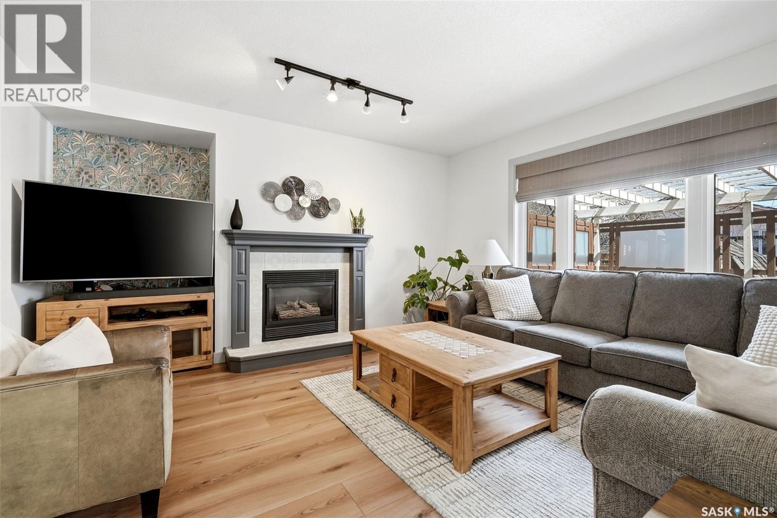 1603 Rousseau Crescent, Regina, SK - Indoor Photo Showing Living Room With Fireplace