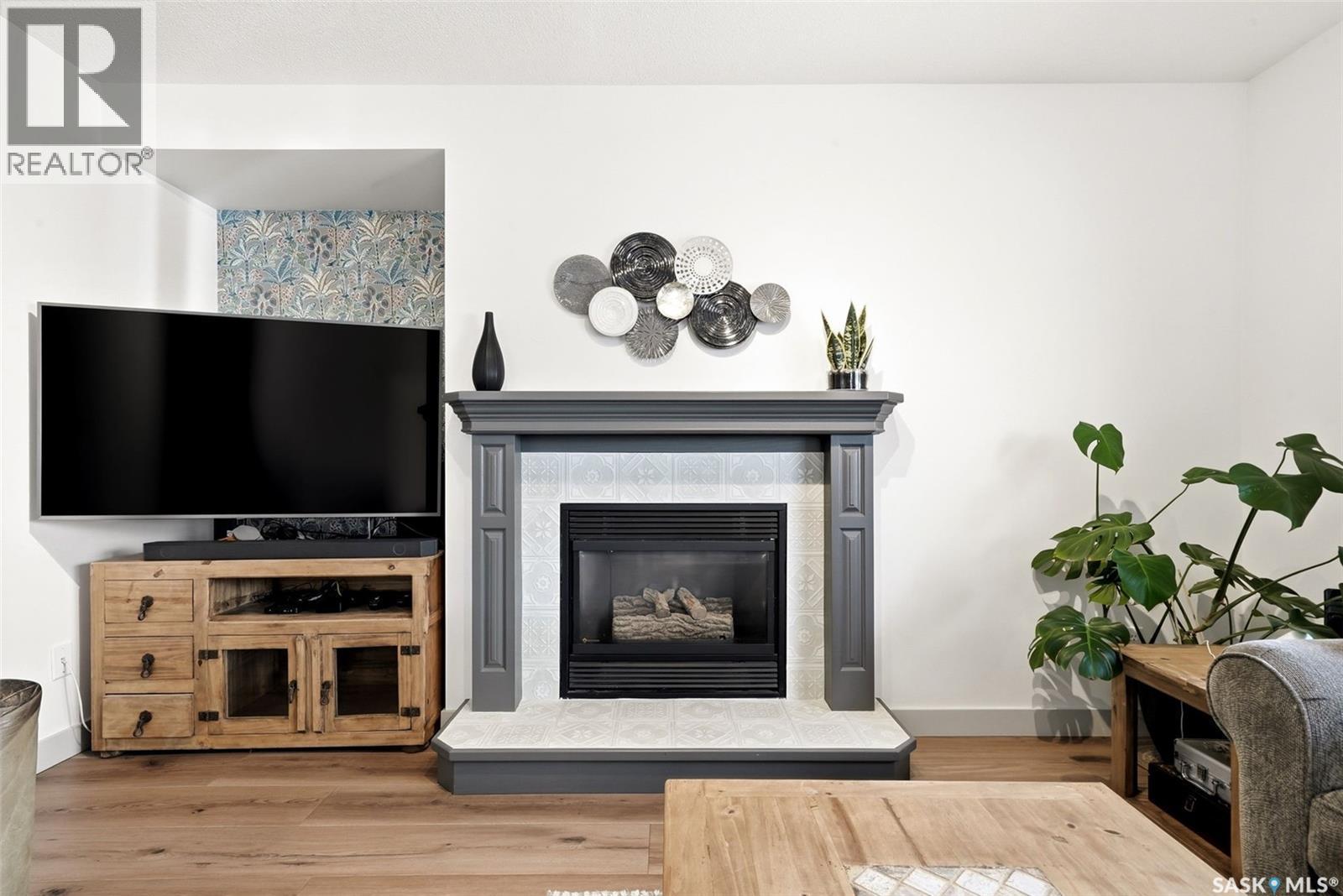 1603 Rousseau Crescent, Regina, SK - Indoor Photo Showing Living Room With Fireplace