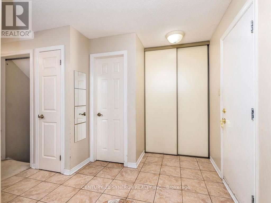 Foyer with powder room, note stairs to basement - 1 Winnegreen Court, Ottawa, ON