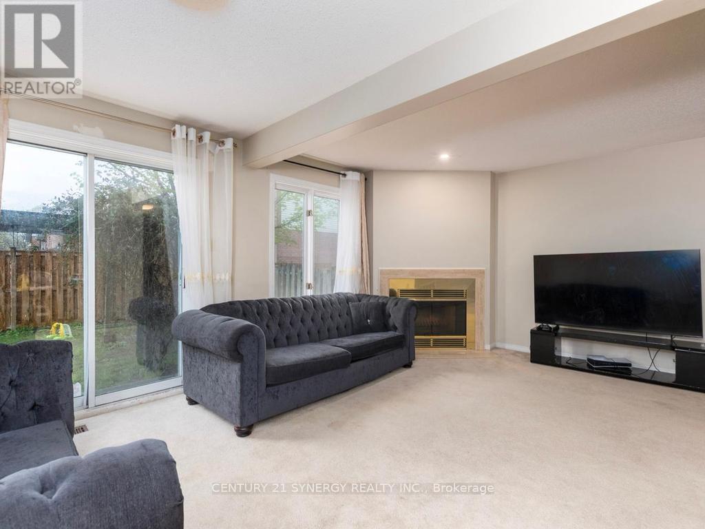 L shaped living/dining room with patio doors. - 1 Winnegreen Court, Ottawa, ON