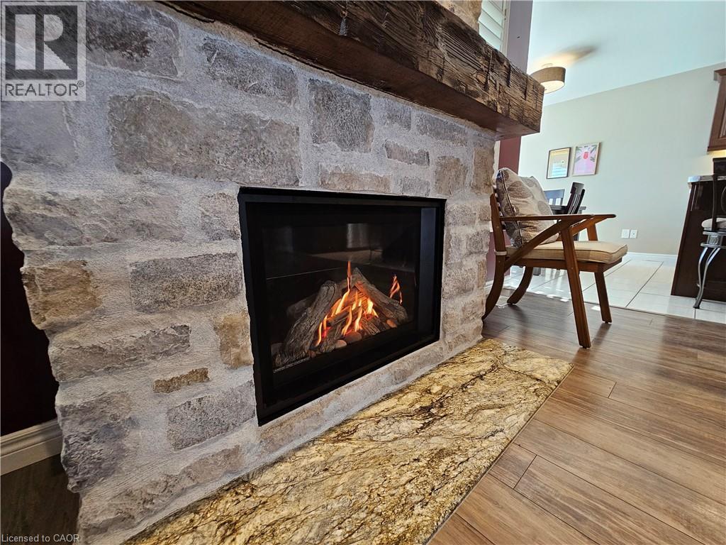 Stone Fireplace - 98 Allandale Crescent, Simcoe, ON - Indoor Photo Showing Living Room With Fireplace