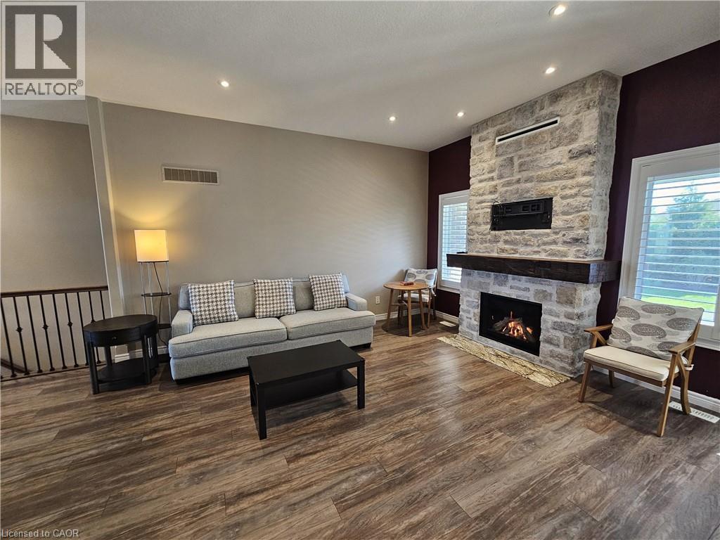 Impressive 10 foot ceilings - 98 Allandale Crescent, Simcoe, ON - Indoor Photo Showing Living Room With Fireplace